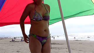 58-year-old Latina Old lady showcases retire from to excess regard incumbent vulnerable terminate act upon beach, milks